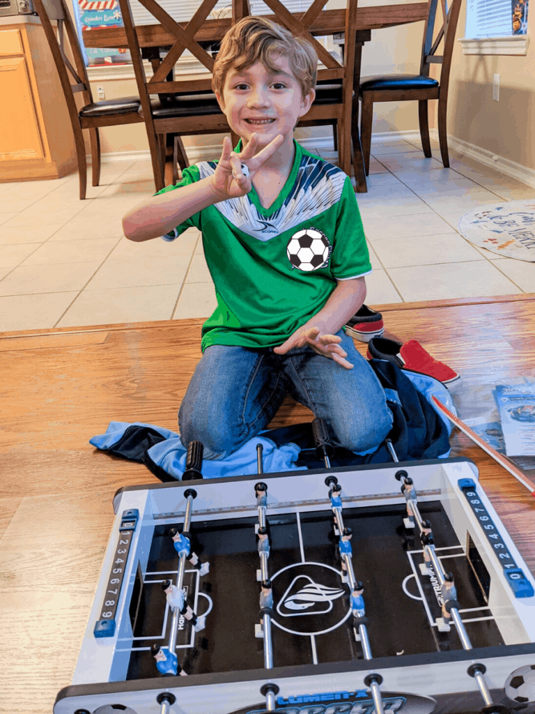 boy preparing to play the foosball game