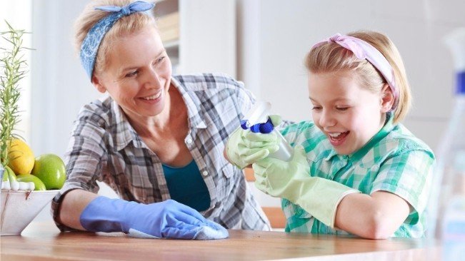 mom cleaning home with daughter