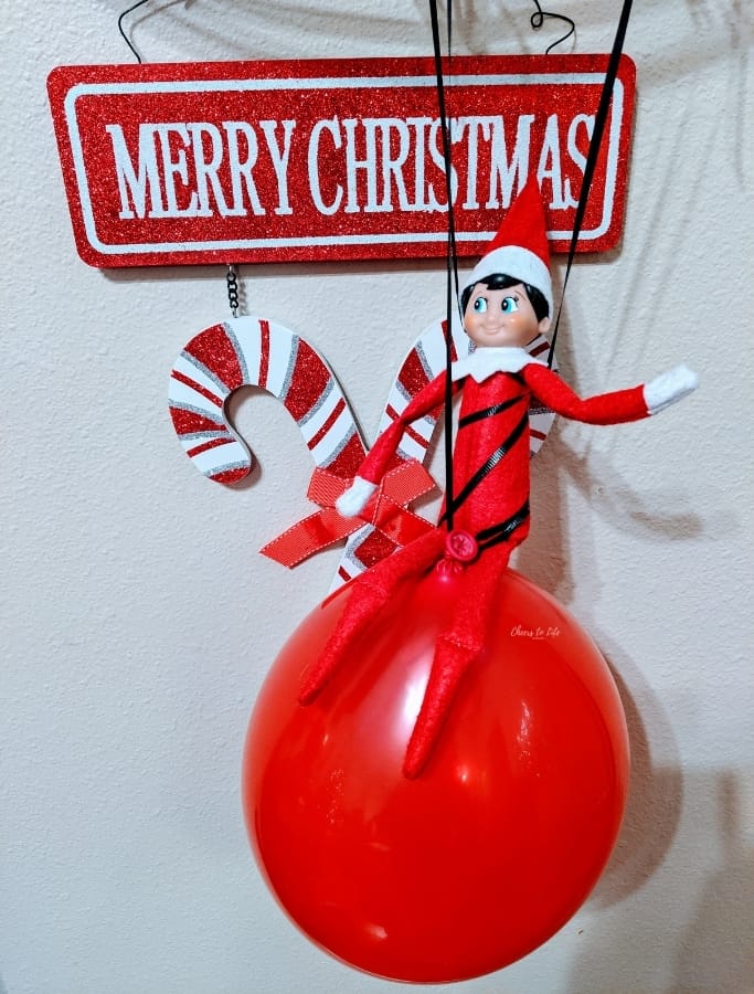 elf on the shelf hanging on by a thread (the balloon thread)