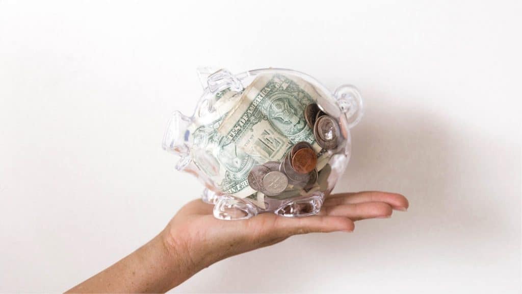 piggy bank filled with money earned from mom side hustles